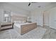 Bright bedroom boasts a stylish bed frame, soft rug, and soothing decor at 11414 Juglans Dr, Odessa, FL 33556