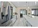 Contemporary kitchen boasting a stainless steel refrigerator, and stone countertops at 11414 Juglans Dr, Odessa, FL 33556