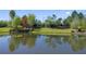 Scenic lake view showcasing the natural beauty and walking trail of the community at 11414 Juglans Dr, Odessa, FL 33556