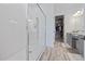 Bright bathroom featuring a large glass enclosed walk-in shower with tile surround at 11414 Juglans Dr, Odessa, FL 33556