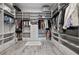 Spacious walk-in closet featuring custom shelving and ample storage space at 11414 Juglans Dr, Odessa, FL 33556
