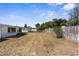 Fenced backyard, with the rear of the home visible on the left side of the frame at 11422 Yellowwood Ln, Port Richey, FL 34668