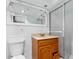 Bathroom with a vanity, a large mirror, and a glass enclosed shower at 11422 Yellowwood Ln, Port Richey, FL 34668