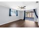 Bedroom with sliding glass doors leading to the back of the house at 11422 Yellowwood Ln, Port Richey, FL 34668
