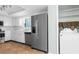 Bright open kitchen with stainless appliances and tile floor at 11422 Yellowwood Ln, Port Richey, FL 34668