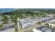 Beautiful aerial view of a condo complex near the water and featuring ample parking at 131 Bluff View Dr # 101, Belleair Bluffs, FL 33770