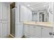Bathroom with enclosed shower, vanity with large mirror, and light-colored countertop and cabinets at 131 Bluff View Dr # 101, Belleair Bluffs, FL 33770