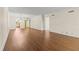 Open-concept living room boasts laminate floors and neutral walls, providing a seamless flow to other rooms at 131 Bluff View Dr # 101, Belleair Bluffs, FL 33770