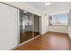 Enclosed sunroom featuring sliding glass doors, laminate floors and a wall of windows bringing the outside in at 131 Bluff View Dr # 101, Belleair Bluffs, FL 33770
