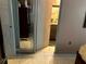View of the bathroom with tiled flooring and cabinets with mirrors at 1312 Foxboro Dr., Brandon, FL 33511