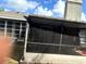 A look at the screened patio with furniture, offering an outdoor relaxation space at 1312 Foxboro Dr., Brandon, FL 33511