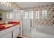 The bathroom features a shower, soaking tub, and sink at 15014 Arbor Hollow Dr, Odessa, FL 33556