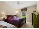 Comfortable bedroom with a cozy bed, decorative accents, and a peaceful view of the outdoors at 15014 Arbor Hollow Dr, Odessa, FL 33556