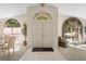 Bright entryway with soaring ceilings, arched windows, and tile flooring at 15014 Arbor Hollow Dr, Odessa, FL 33556