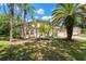 Charming single-story home with desert landscaping and a beautiful palm tree at 15014 Arbor Hollow Dr, Odessa, FL 33556