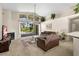 Comfortable living area with vaulted ceilings and access to the outdoor pool area at 15014 Arbor Hollow Dr, Odessa, FL 33556