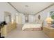 Serene main bedroom featuring elegant decor, a ceiling fan, and ample natural light from the windows at 15014 Arbor Hollow Dr, Odessa, FL 33556