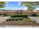 Inviting exterior view of home with attached garages, lush landscaping, and tile roof at 17557 Fairmeadow Dr, Tampa, FL 33647