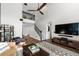 Open living room shows a soaring ceiling, hardwood floors, and a staircase to the second floor at 17557 Fairmeadow Dr, Tampa, FL 33647