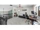 Open loft area with neutral walls, desk, chair, and ceiling fan, perfect for a home office setup at 17557 Fairmeadow Dr, Tampa, FL 33647