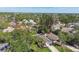 Aerial view showcasing a neighborhood with tree-lined streets, glimpses of the lake, and well-maintained homes at 1775 Michigan Ne Ave, St Petersburg, FL 33703