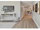 Hallway featuring wood floors, a console table, and stylish artwork at 1775 Michigan Ne Ave, St Petersburg, FL 33703
