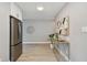 Kitchen area featuring stainless steel appliances, white cabinetry, stylish backsplash, and hardwood floors at 1775 Michigan Ne Ave, St Petersburg, FL 33703