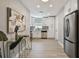 Bright kitchen with stainless steel appliances, modern white cabinets, and wood tile flooring at 1775 Michigan Ne Ave, St Petersburg, FL 33703