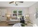 Bright living room with a comfortable sofa, stylish lamps, and a view of the lush outdoors at 1775 Michigan Ne Ave, St Petersburg, FL 33703