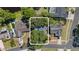 Aerial view of the home and surrounding neighborhood showcases lush trees, green spaces, and community layout at 1849 Diane Dr, Clearwater, FL 33759