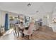 Open-concept dining area with large sliding doors and a modern table set perfect for entertaining at 1849 Diane Dr, Clearwater, FL 33759