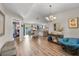 Spacious living area featuring hardwood floors, stylish decor, and plenty of natural light at 1849 Diane Dr, Clearwater, FL 33759