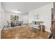 Bright dining room featuring a stylish table setting, ample lighting, and warm toned flooring at 2214 Wilshire Dr, Dunedin, FL 34698