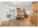 Open-concept kitchen featuring warm wood cabinetry, granite countertops, and stainless steel appliances at 2214 Wilshire Dr, Dunedin, FL 34698