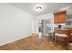 Bright breakfast nook with bar seating, seamlessly connecting to the main kitchen area with tile flooring at 2214 Wilshire Dr, Dunedin, FL 34698