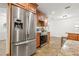 Modern kitchen with stainless steel refrigerator and granite countertops at 2214 Wilshire Dr, Dunedin, FL 34698