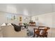 Another view of the living room with plenty of seating and natural light from the windows at 2214 Wilshire Dr, Dunedin, FL 34698