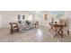 A relaxing living room with a decorative rug, comfortable furniture and plenty of natural light at 2214 Wilshire Dr, Dunedin, FL 34698