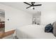A closer view of the main bedroom featuring an overhead ceiling fan and an adjacent walk-in closet at 2214 Wilshire Dr, Dunedin, FL 34698