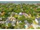 An aerial view showcasing a lush, green neighborhood near water, ideal for tranquil living at 2304 S Occident St, Tampa, FL 33629