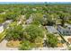 Neighborhood aerial view featuring lush greenery and a distant city skyline, offering a tranquil setting at 2304 S Occident St, Tampa, FL 33629