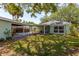 Rear view showing large back yard with covered patio at 2304 S Occident St, Tampa, FL 33629