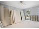 Bedroom with windows awaiting renovation, and white paneled doors stacked against the wall at 2304 S Occident St, Tampa, FL 33629