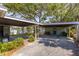 Spacious carport with ample parking and access to backyard entertainment area at 2304 S Occident St, Tampa, FL 33629