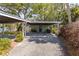 Spacious carport with ample parking and access to a storage area at 2304 S Occident St, Tampa, FL 33629
