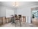 Dining area featuring a table with chairs, awaiting renovation, adjacent to other rooms at 2304 S Occident St, Tampa, FL 33629