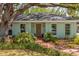 Charming single-story home with a lush front yard and inviting brick walkway at 2304 S Occident St, Tampa, FL 33629