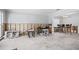 Renovation-ready living room with a kitchen sink, stools, and a glimpse of the dining room at 2304 S Occident St, Tampa, FL 33629