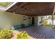 Covered patio with brick flooring, offering a cozy outdoor living space at 2304 S Occident St, Tampa, FL 33629