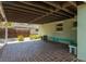 Covered patio with brick flooring, providing a comfortable outdoor setting at 2304 S Occident St, Tampa, FL 33629